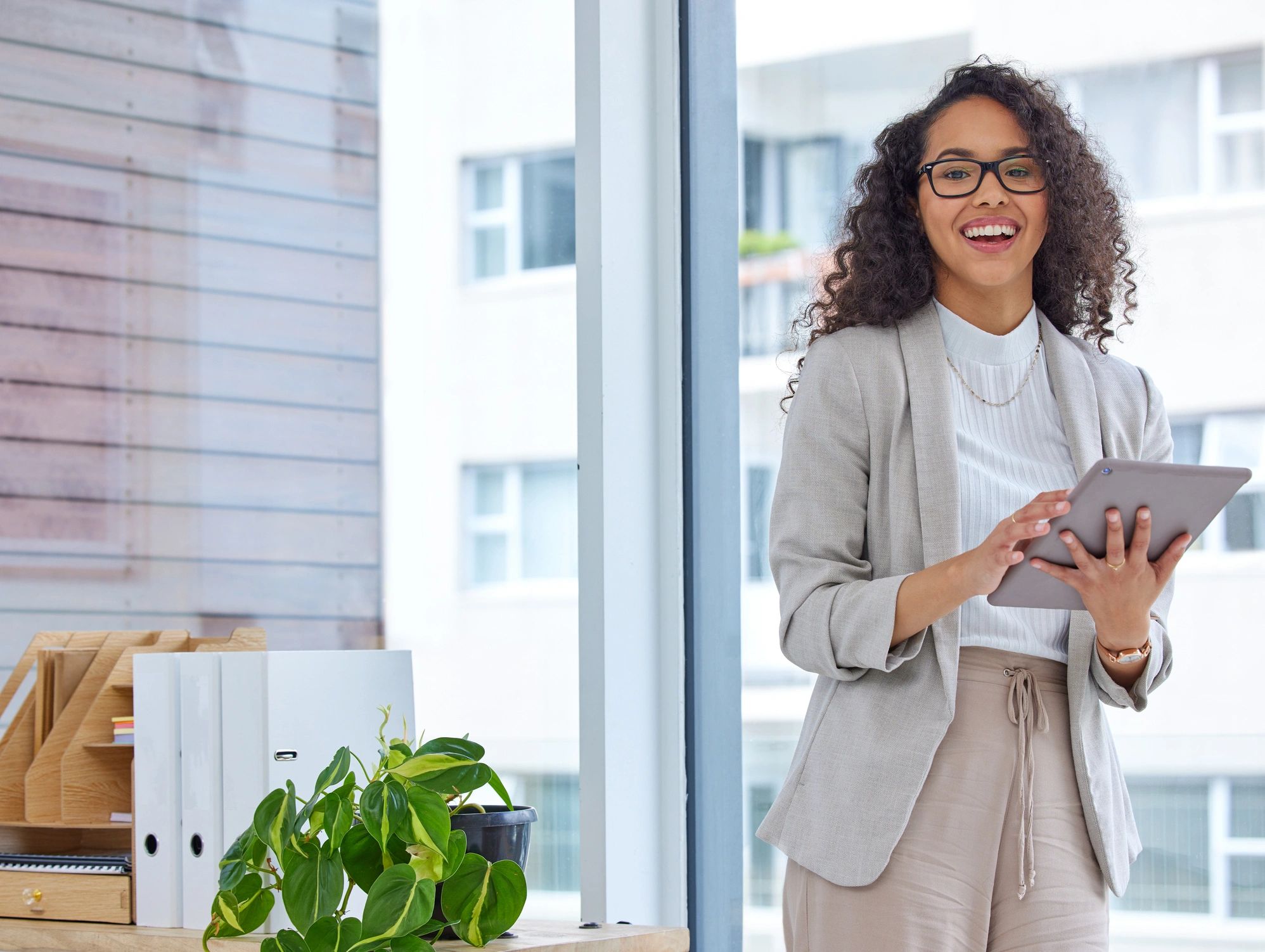 Professional woman using a tablet in a modern office