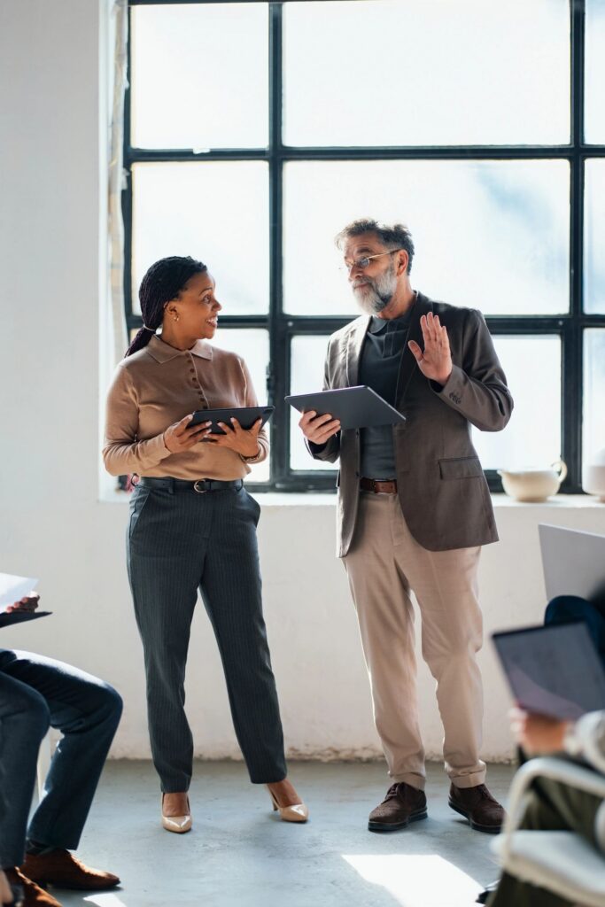 Professional Colleagues Discussing Strategy During a Business Meeting in a Modern Office